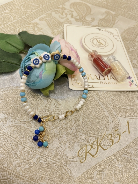 Blue Evil Eye Pearl Ladies Bracelet Rakhi RK35-1 | Premium Lumba Rakhi for Bhabhi